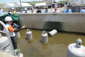 岡山県協、地震・風水害に備える　容器流出を想定し増水実験も実施